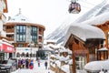 Ischgl, Austria- January 10th, 2018: Central square of austrian alpine winter resort Ischgl with hotels, tourists and Silvretta