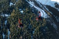 Ischgl, Austria- January 10th, 2018: New modern spacious big cabin gondola PARDATSCHGRATBAHN against forest mountain Royalty Free Stock Photo