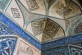 Arabic Quranic calligraphy witten in Thuluth script on polychrome tiles, on the corner of the Imam Mosque