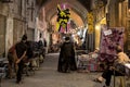 ISFAHAN, IRAN - AUGUST 20, 2016: Imam passing under a Batman logo in Isfahan bazaar Royalty Free Stock Photo