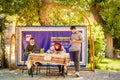 Isfahan, Iran - iranians sit learn symbols to write in Farsi language display corner in Isfahan Jame mosque courtyard