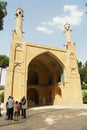 People visit Monar Jonban Shaking Minarets built 14-th century in Isfahan, Iran.