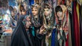 Iranian woman looking at hijab and head scarf at Bazar Bozorg, also known as the Grand Bazaar, Isfahan, Iran Royalty Free Stock Photo