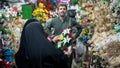 Iranian women buying fake flowers in a flower shop in Grand Bazaar of Isfahan, Iran