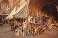 Marketplace with sellers of good, stuff in walls of building of Eastern Bazaar