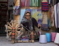 Isfahan, Iran - 2019-04-12 - Woman spins yarn on a manual spinner