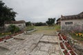 Wall, village, tree, house, plant, landscape, sky, walkway, courtyard, outdoor, structure, estate Royalty Free Stock Photo