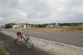 Road, land, vehicle, cycling, bicycle, lane, sky, transport, mode, of, cloud, asphalt, racing, path, rural, area, recreation, surf Royalty Free Stock Photo