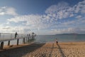 Sea, sky, cloud, beach, horizon, body, of, water, ocean, pier, shore, coast, sand, coastal, and, oceanic, landforms, vacation, wav Royalty Free Stock Photo