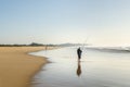 Isimangaliso wetland man fishing in the indian ocean