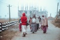 ISKCON Mayapur, West Bengal, India - Dec 15, 2019. international group of pilgrims in national Vaishnava clothes saris