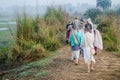 ISKCON Mayapur, West Bengal, India - Dec 15, 2019. international group of pilgrims in national Vaishnava clothes saris