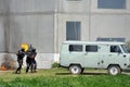 Soldiers of the special forces unit lead the detainee into the car