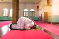 Islam muslim man in custom dress praying in mosque Royalty Free Stock Photo