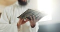 Islam, prayer and man in mosque with Quran, mindfulness and gratitude in faith reading in peace. Worship, religion and Royalty Free Stock Photo