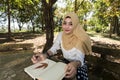 Islam woman write diary Royalty Free Stock Photo