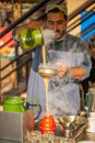 A man making a tea at tea stall in a winter morning