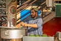 A man making a tea at tea stall in a winter morning