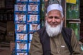 Unidentified Pakistani elderly man with a long white beard wearing a white hat