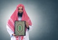 Islamic Arabian Shiekh presenting Quran