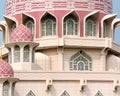 Islamic architecture, details of mosque exterior, dome with decorative pattern, arched windows Royalty Free Stock Photo