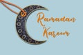 Islamic background crescent moon tag on blue background.