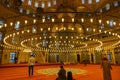 Islamic background photo. Muslims praying in Eminonu New Mosque or Yeni Cami Royalty Free Stock Photo