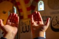 Praying Muslim man by raising hands and Calligraphy of the name of Allah.