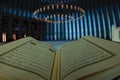 Islamic concept photo. Holy Quran in the mosque in focus.