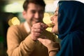 Islamic European couple shares laughter and enjoyment while savoring delicious pastries during iftar in the holy month Royalty Free Stock Photo