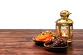 Islamic festival of Ramadan concept. Delicious tropical dates, dried figs, dried apricots on bamboo plates, rosary beads with a la