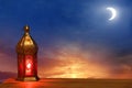 Islamic greeting Eid Mubarak cards for Muslim Holidays.Eid-Ul-Adha festival celebration.Arabic Ramadan Lantern on wooden table.