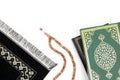 Islamic Holy Book Quran with rosary beads and prayer rug on isolated white background. Kuran the holy book of Muslims. Ramadan con