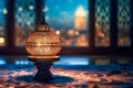 Islamic lantern opposite window with blurred night cityscape