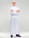 Islamic man, smile portrait and muslim fashion standing in white background for Arabic culture. Young person, smile and