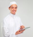 Islamic man, tablet and happy portrait for Muslim reading, education or culture standing in white background. Young