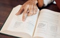 Islamic, muslim and Quran with hand of old woman reading holy book for prayer, worship or ramadan kareem celebration Royalty Free Stock Photo