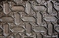 Islamic patterns and Arabic calligraphy in metal surface of door the 16th centure Seville Cathedral, Spain