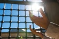 Islamic photo. Praying muslim woman in a mosque with direct sunlight