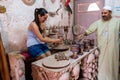 An Islamic potter teaching a female tourist making ceramic pots in Heritage villages in Abu Dhabi, United Arab Emirates