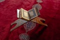 Islamic or ramadan concept photo. Holy Quran on the lectern in top view