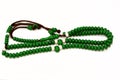 Islamic rosary in green color with 99 rosary beads that Muslims use it to give praise to Allah using sentences to mention God like