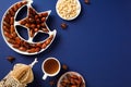 Islamic star and crescent plate with dried dates, nuts, drink, wooden oriental lantern on dark blue background. Ramadan Kareem