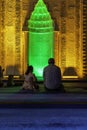 Islamic vertical background photo. A muslim man praying and his daughter