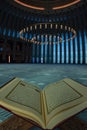 Islamic vertical photo. The Holy Quran in focus in a mosque