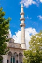 Islamic vertical photo. Minaret of Eminonu New Mosque or Yeni Cami in Istanbul Royalty Free Stock Photo