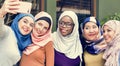 Islamic women friends taking selfie together