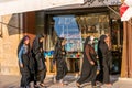 Islamic women tourists walking pass by the shops situated inside of Naqsh-i Jahan Square , an important historical site