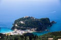 Island aerial view blue ocean behind. Beautiful Greek landscape. Corfu Greece natural places and beaches. Mountain next to sea wat Royalty Free Stock Photo