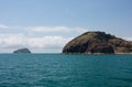 An island in the background and an outcrop at the Rosslyn Bay near Yeppoon in Capricorn area in Central Queensland, Australia